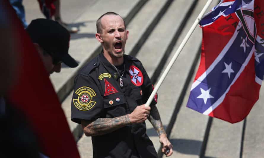 A Ku Klux Klan member shouts racial slurs to African Americans at a Klan demonstration at the state house building on 18 July 2015 in Columbia, South Carolina.