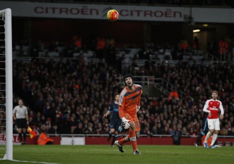Petr Cech watches the ball curl over him into the net.