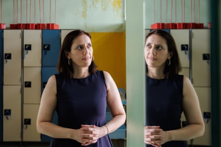 Emma-Özlen Kaya reflected in a mirror in the pool’s changing room
