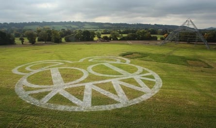 Radiohead’s ‘demonic bear face’ logo painted in the grass at Worthy Farm, announcing their 2017 Glastonbury headline slot.