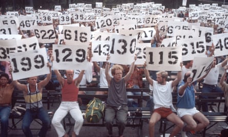 People hold up signs representing the numbers of Aids patients in a demonstration in support in Central Park, New York, 8 August 1983.