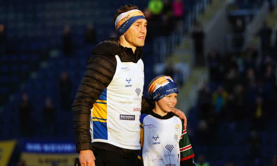 Kevin Sinfield walks into Headingley Stadum with Rob Burrow’s daughter, Macy.