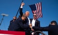 ‘The flag and the fist together are what make this so powerful’ … Trump’s first in parallel with the American flag.