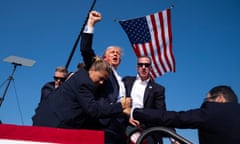 ‘The flag and the fist together are what make this so powerful’ … Trump’s first in parallel with the American flag.
