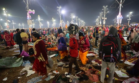 Attendees walk in a crowd after a stampede before the 'Amrit Snan' at the Kumbh Mela on January 29, 2025 in Allahabad, India. It is unclear what caused the stampede but fatalities have been reported. The Kumbh Mela in 2025 is a Maha Kumbh, which is a significant Hindu festival celebrated once every 144 years at Prayagraj (Allahabad). Scheduled from January 13 to February 26, 2025, it attracts millions of devotees for ritual bathing at the confluence of the Ganges, Yamuna, and the mythical Saraswati rivers, marking a unique spiritual occasion with enhanced significance compared to regular Kumbh Mela. (Photo by Ritesh Shukla/Getty Images)