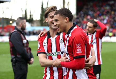 Ryan Oné celebrates with a teammate after Lincoln beat AFC Wimbleon 1-0 in League One.