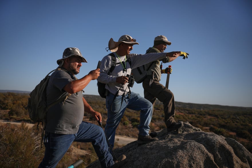 Jesse and Alfredo Barajas, two of the victim’s brothers, and his son, José, search an area near his ranch last month. José Barajas was dragged from his home near the town of Tecate on 8 April, 2019 and has not been seen since.