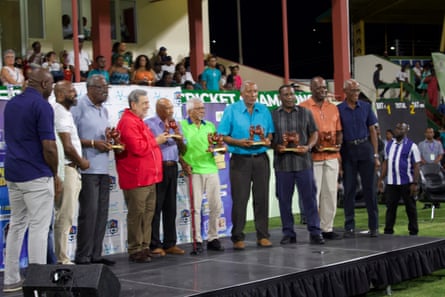 a line of men on a low stage