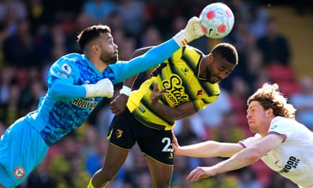 David Raya punches the ball away when playing for Brentford against Watford in April 2022
