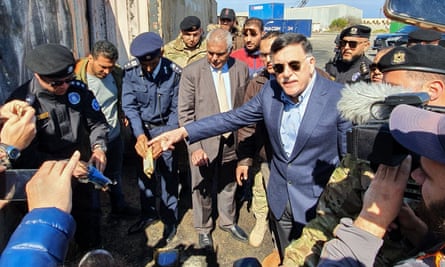 Fayez al-Sarraj, the prime minister of Libya’s UN-recognised Government of National Accord, visits the port in the capital Tripoli after it was hit by rocket fire on 20 February.