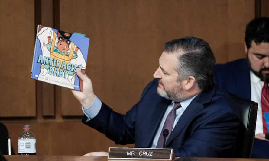 Senator Ted Cruz (R-TX) holds up the children's book Antiracist Baby by Ibram X Kendi as he questions Judge Ketanji Brown Jackson during her confirmation hearing on Tuesday.
