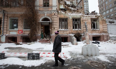 A man walks past a residential building destroyed by a Russian drone in Kyiv, Ukraine on 12 January 2023.