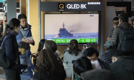 A TV screen in Seoul shows a file image of a South Korean navy vessel during a news program on Monday, 24 October.