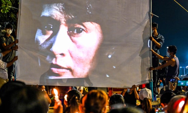 An image of detained civilian leader Aung San Suu Kyi is projected on a screen