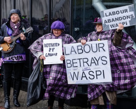 A group of women holding signs with slogans including 'Labour betrays Waspi'.
