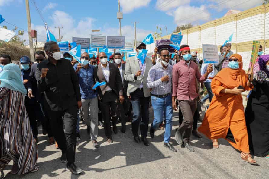Former prime minister Hassan Ali Khaire, centre, joins members of opposition parties as they protest against the political impasse in Mogadishu, 19 February 2021.