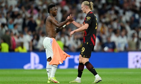Vinicius Junior of Real Madrid embraces Erling Haaland of Manchester City after the draw during the Champions League semi-final first leg match between Real Madrid and Manchester City.