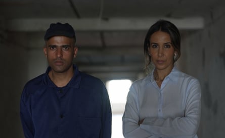 Al-Maghafi standing with Khalil at the prisoner of war camp.