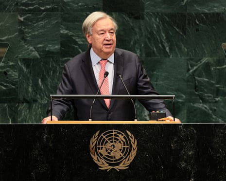 Guterres speaks at a podium bearing the United Nations emblem