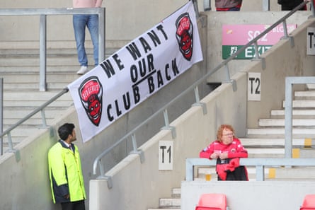 Salford Red Devils fans’ banner with a message to club during the Betfred Super League match at Wigan Warriors in May.