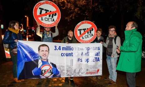 Protesters hold up a placard reading ‘3.4 million Europeans count on Wallonia – stop Ceta’ outside a meeting at the Walloon parliament in Namur, Belgium.