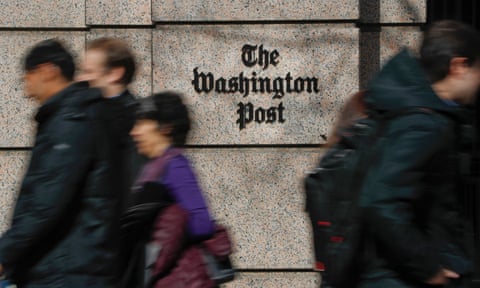 People walk by the One Franklin Square Building, home of The Washington Post newspaper