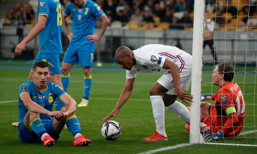 Anthony Martial grabs the ball after scoring France's equaliser in Ukraine