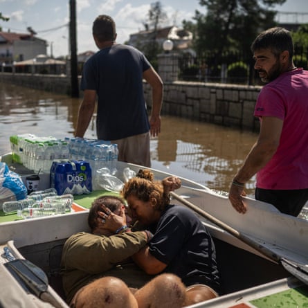 Volunteers rescue local people in the flooded village of Palamas near the city of Karditsa, central Greece, on 8 September