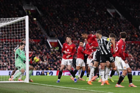 Manchester United keeper Senne Lammens saves a header from Newcastle’s Bruno Guimaraes (second right).