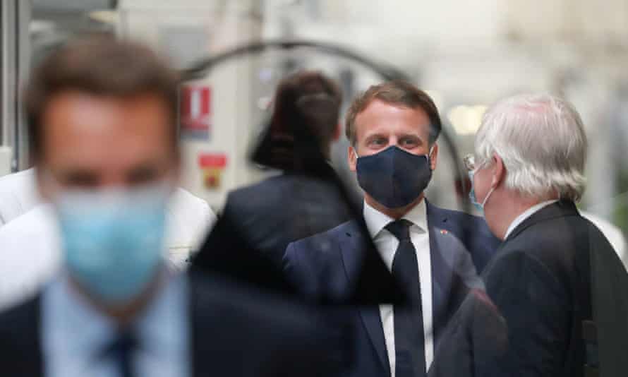 The French president, Emmanuel Macron, wears a mask as he visits a car factory in Étaples, France, to discuss his coronavirus recovery plan.
