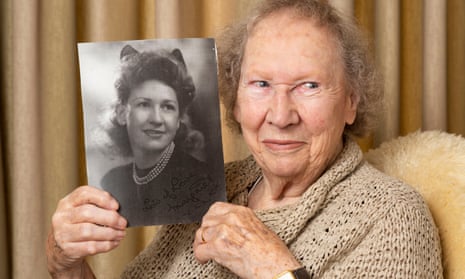 Margaret Ford holds a picture of herself when she was 18, taken in 1945