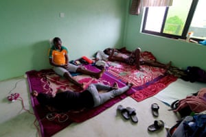 Footballers from west Africa rest in their room in Kathmandu