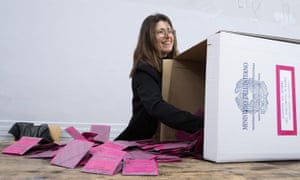A ballot box is emptied as polling staff wait to count the votes for the European parliament election in Rome