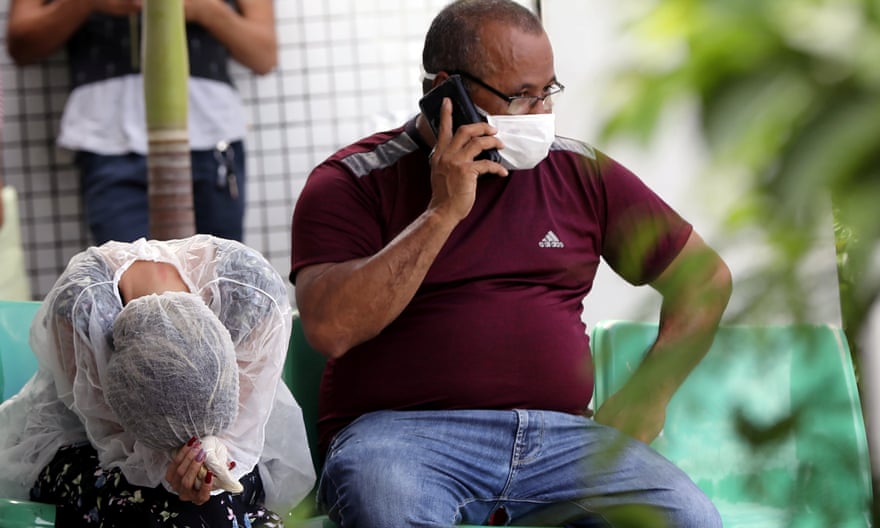 Relatives of a coronavirus victim react at the Dr João Lucio Pereira Machado hospital in Manaus last week.