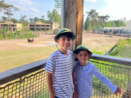 The writer’s children on a balcony overlooking the animals