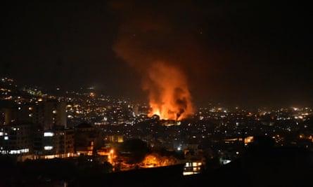 Smoke billows from the site of an Israeli airstrike that hit a suburb in the south of Beirut on 28 September 2024.