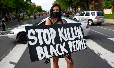 Police abuse protest in wake of George Floyd death in Minneapolis<br>epaselect epa08446273 Amy Gee of Minneapolis holds a sign reading ‘Stop Killin’ Black People’ near the scene of the arrest of George Floyd, who later died in police custody, in Minneapolis, Minnesota, USA, 26 May 2020. A video posted online on 25 May, appeared to show George Floyd, 46, pleading with arresting officers that he couldn’t breathe as an officer knelt on his neck. The unarmed black man died in police custody. EPA/CRAIG LASSIG