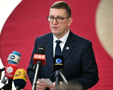Estonia’s prime minister Kristen Michal answers journalists’ questions upon his arrival for a European Union summit at the EU headquarters in Brussels.