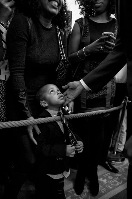 Obama greets a young guest at the White House in February 2016.