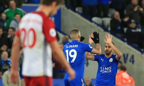 Leicester City’s Riyad Mahrez, right, celebrates after scoring their equaliser.