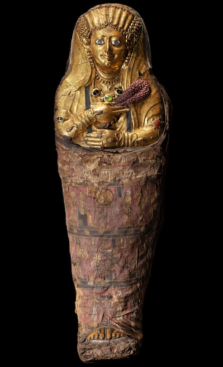 The gilded mummy of a child, at Manchester Museum’s ‘Golden Mummies of Egypt’ exhibition