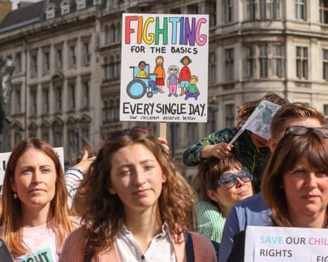 Parents and carers outside parliament during a rally in September