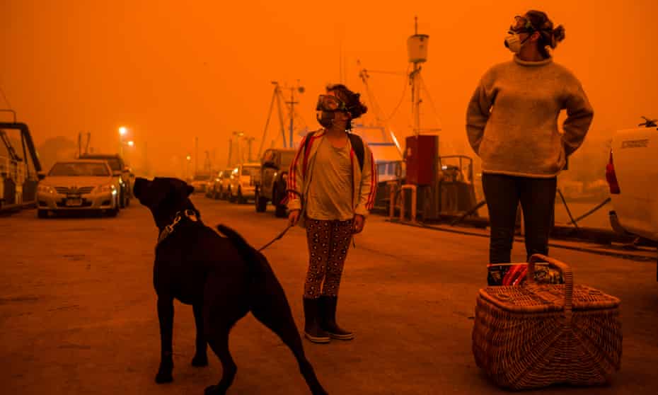 Residents of Eden, NSW, prepare to shelter from fires aboard a boat, January 2020