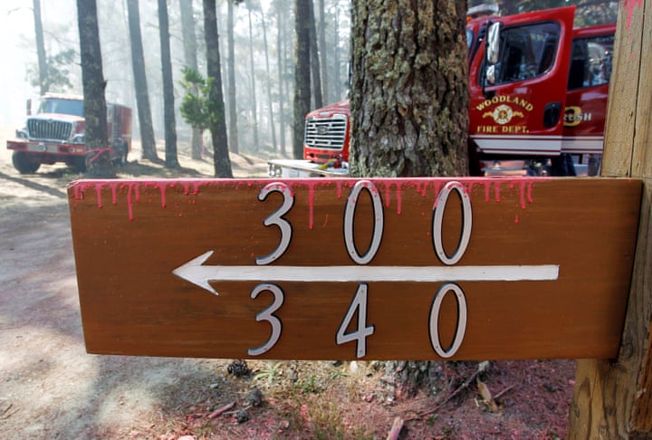 Dried fire retardant sticks to property numbers in the mountains above Carmel Highlands