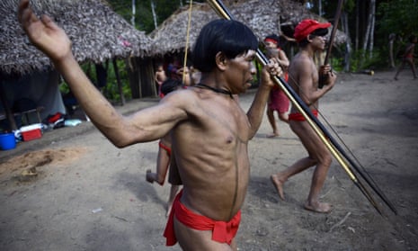 Yanomami natives perform a ritual dance by the Brazil-Venezuela border.