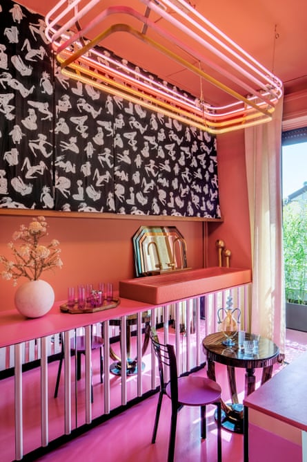 Reflective surfaces, strong colours and a black and white erotic mural in the kitchen.