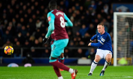 Everton’s Wayne Rooney shoots from beyond the halfway line to score his third goal against West Ham at Goodison Park on Wednesday night.