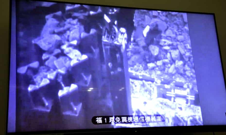 A monitor shows the operation in the No.3 reactor building at Fukushima Daiichi nuclear power plant