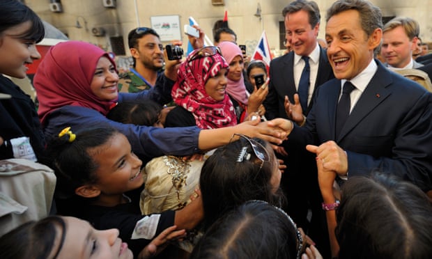 David Cameron and Nicolas Sarkozy are greeted by Libyans in 2011