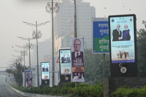 Banners and digital billboards of Indian prime minister Narendra Modi welcoming Keir Starmer in Mumbai, India.